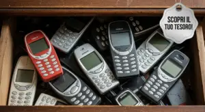 Vecchi telefoni cellulari ammassati in un cassetto di legno